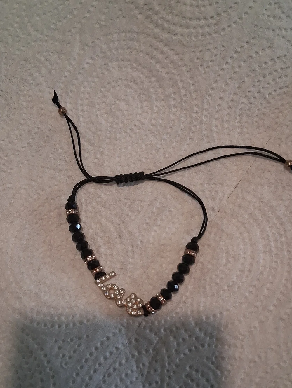 Bundle This Love-Script Beaded Adjustable Bracelet in Black and Gold